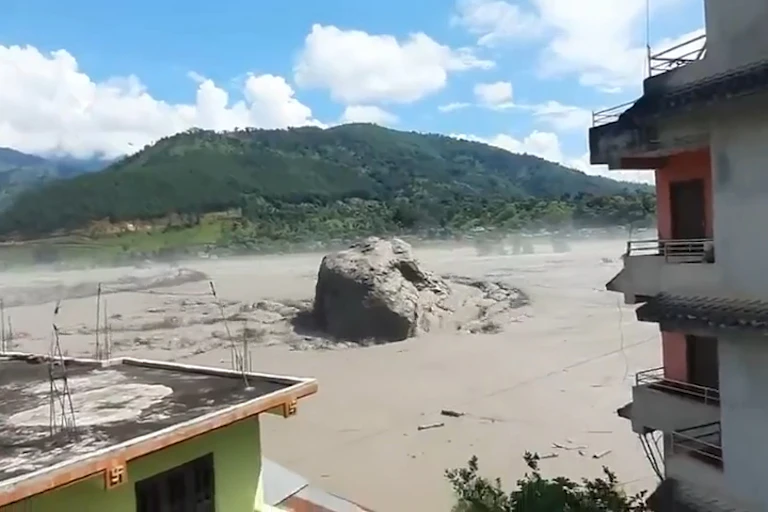 A large boulder is pushed along with the Nepal flood