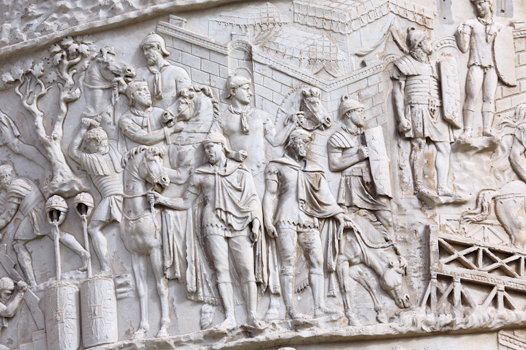 A stone relief showing ancient Roman soldiers from Trajan Column in Rome