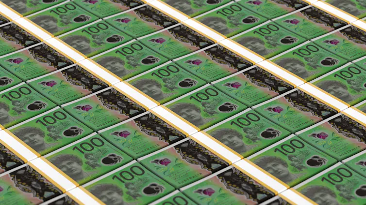 Rows and rows of stacked $100 notes