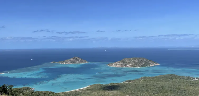 Coral islands in the middle of a turquoise sea.