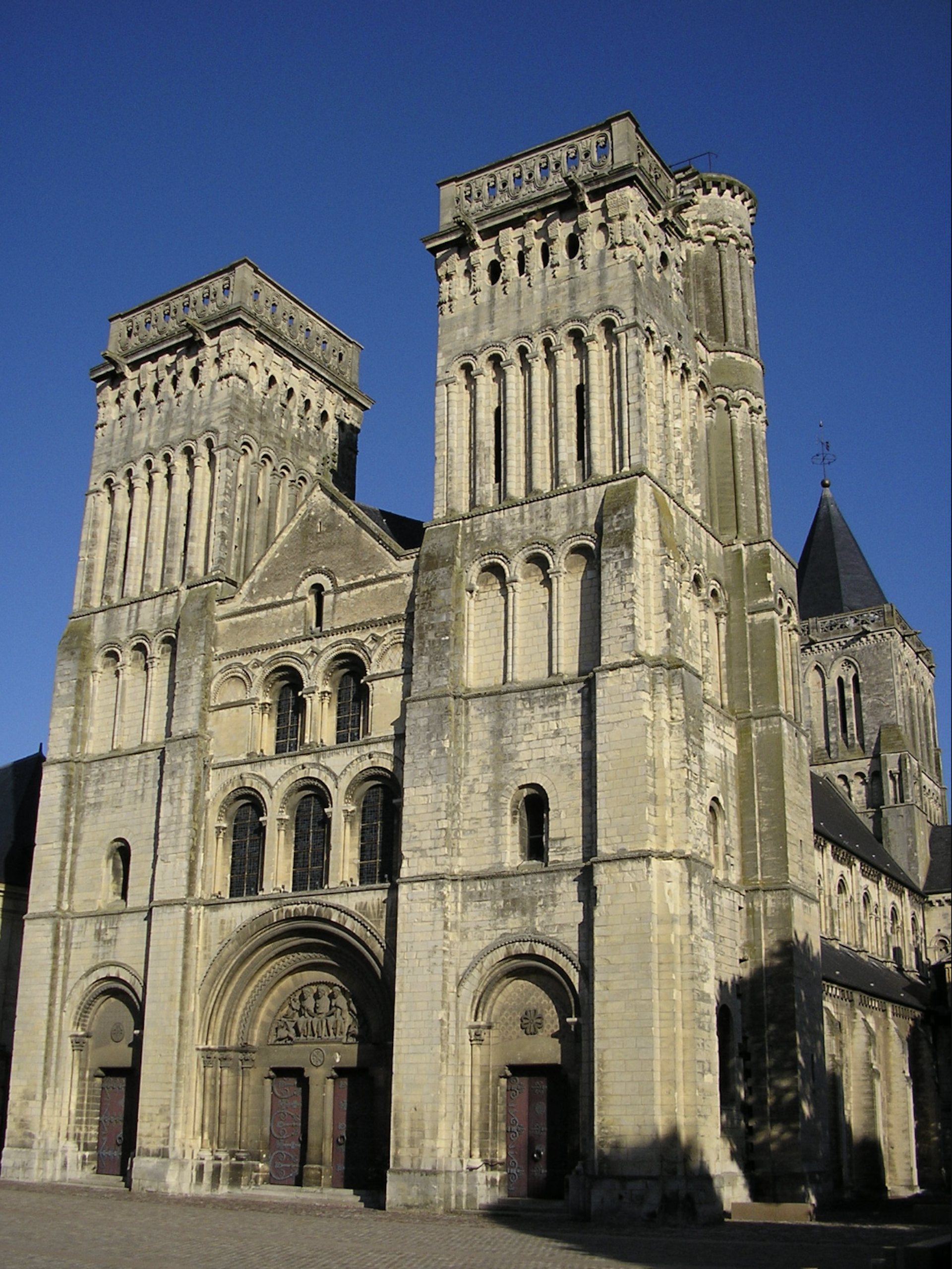 A large medieval abbey made of stone.