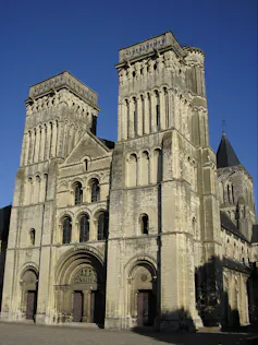 A large medieval abbey made of stone.