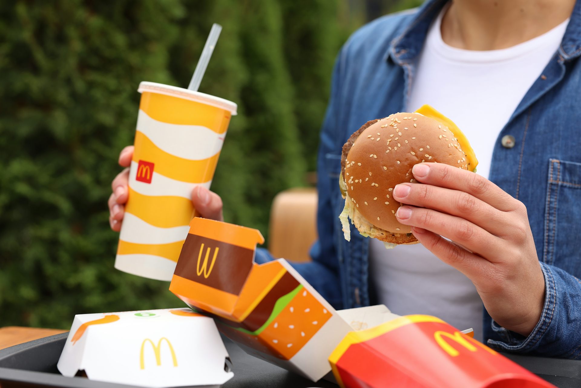 A person eating a McDonalds.