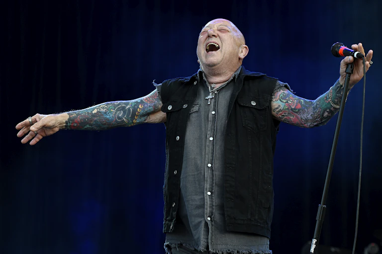 Angry Anderson performs on stage in 2025.