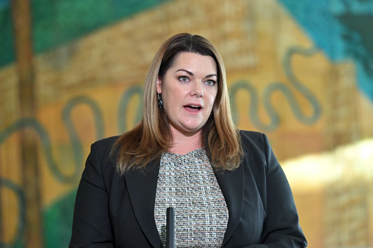 A woman speaking at a press conference