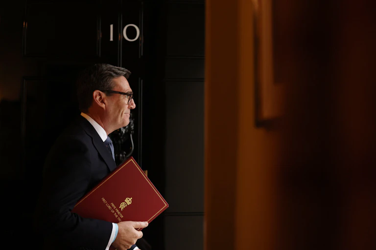 andy burnham leaving 10 downing street with his red folder under his arm