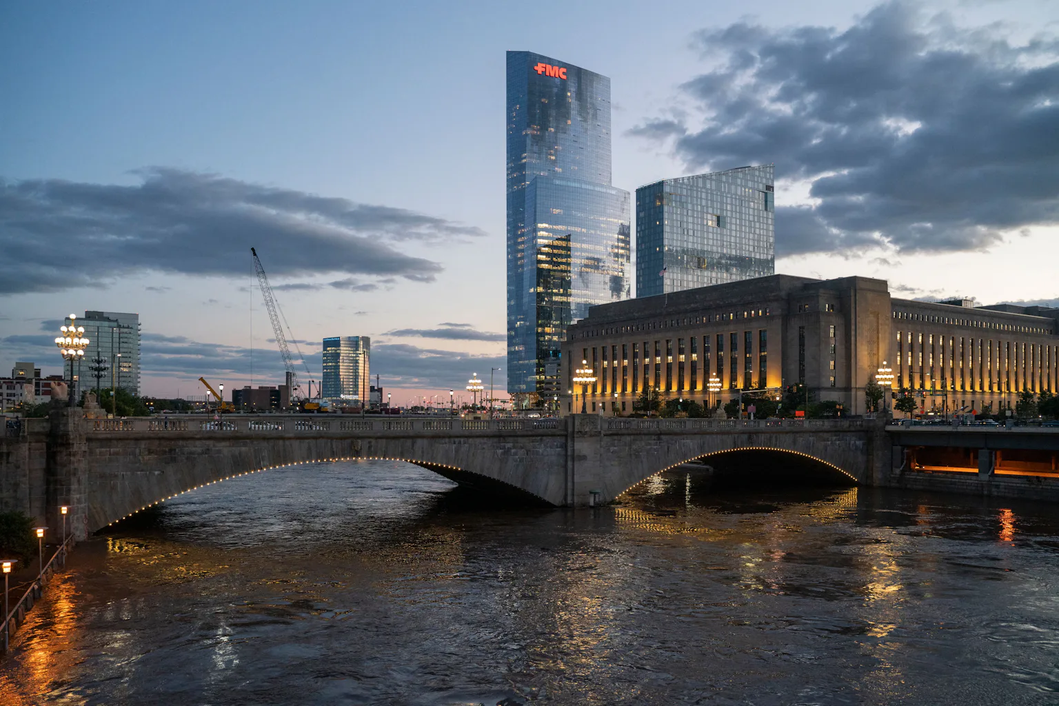 View of bridge over water with skyscrapers in background