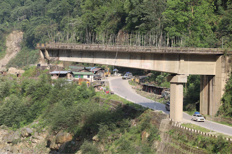 bridge and road on hillside,