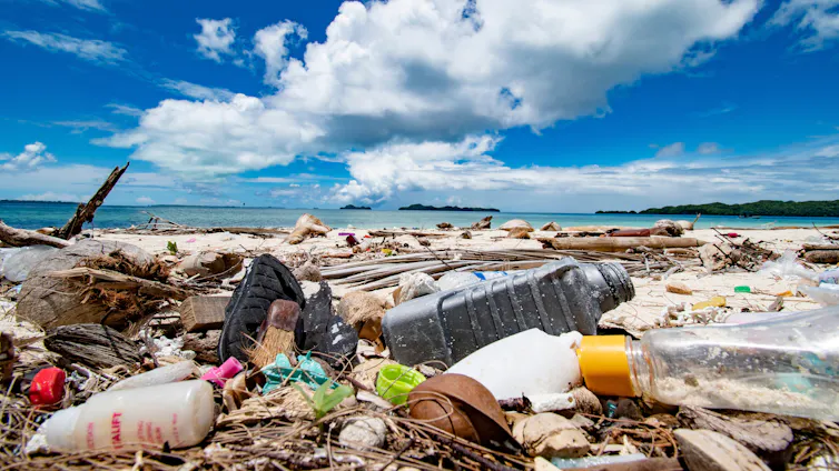 A collection of plastic waste on a beach.