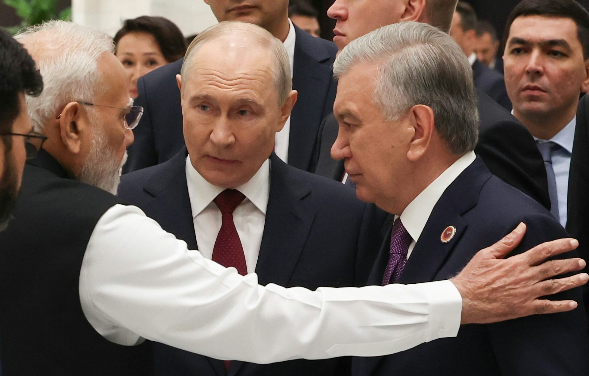 Indian Prime Minister Narendra Modi (L), Russian President Vladimir Putin (C) and Uzbek President Shavkat Mirziyoyev .