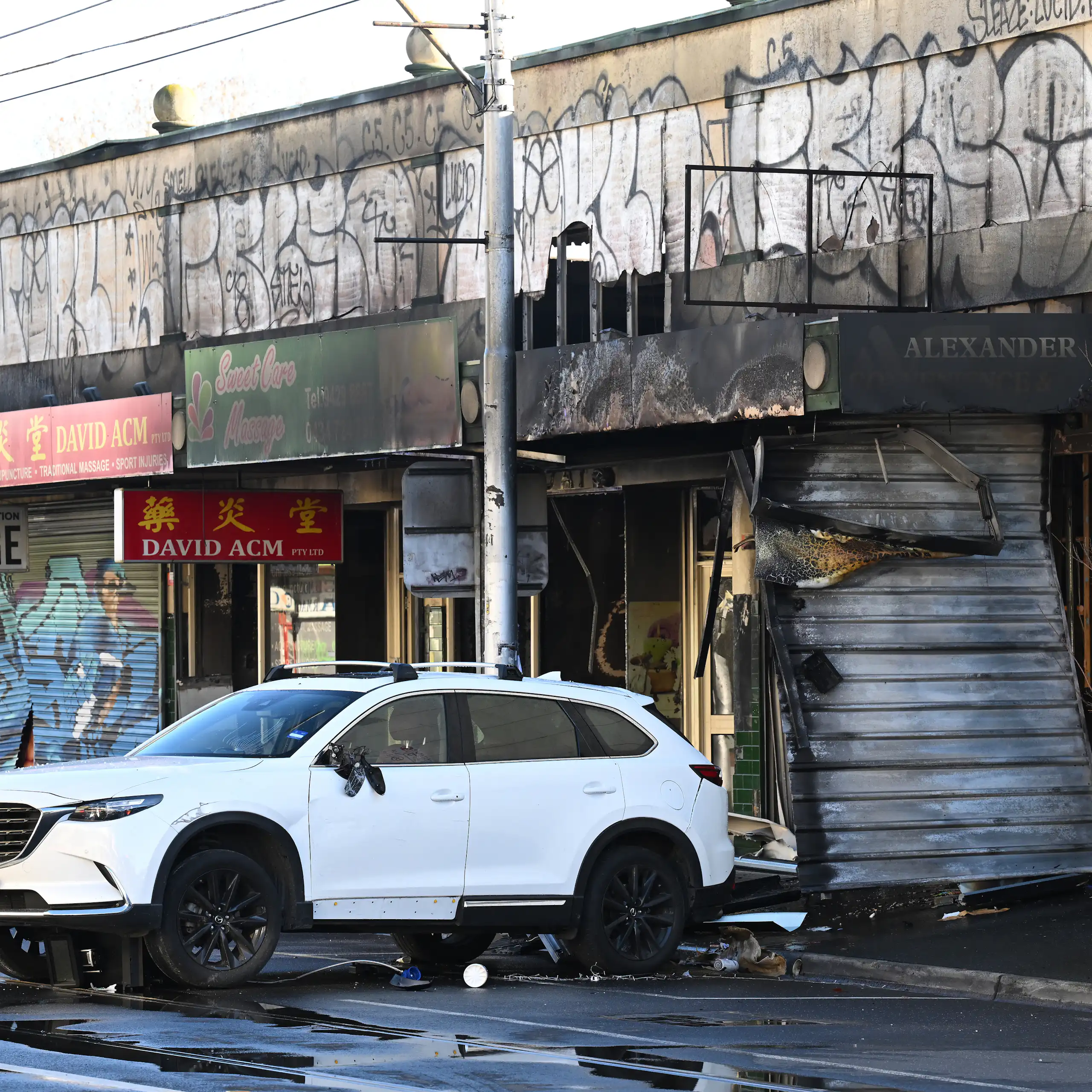shops engulfed by fire after a tobacco shop was set alight