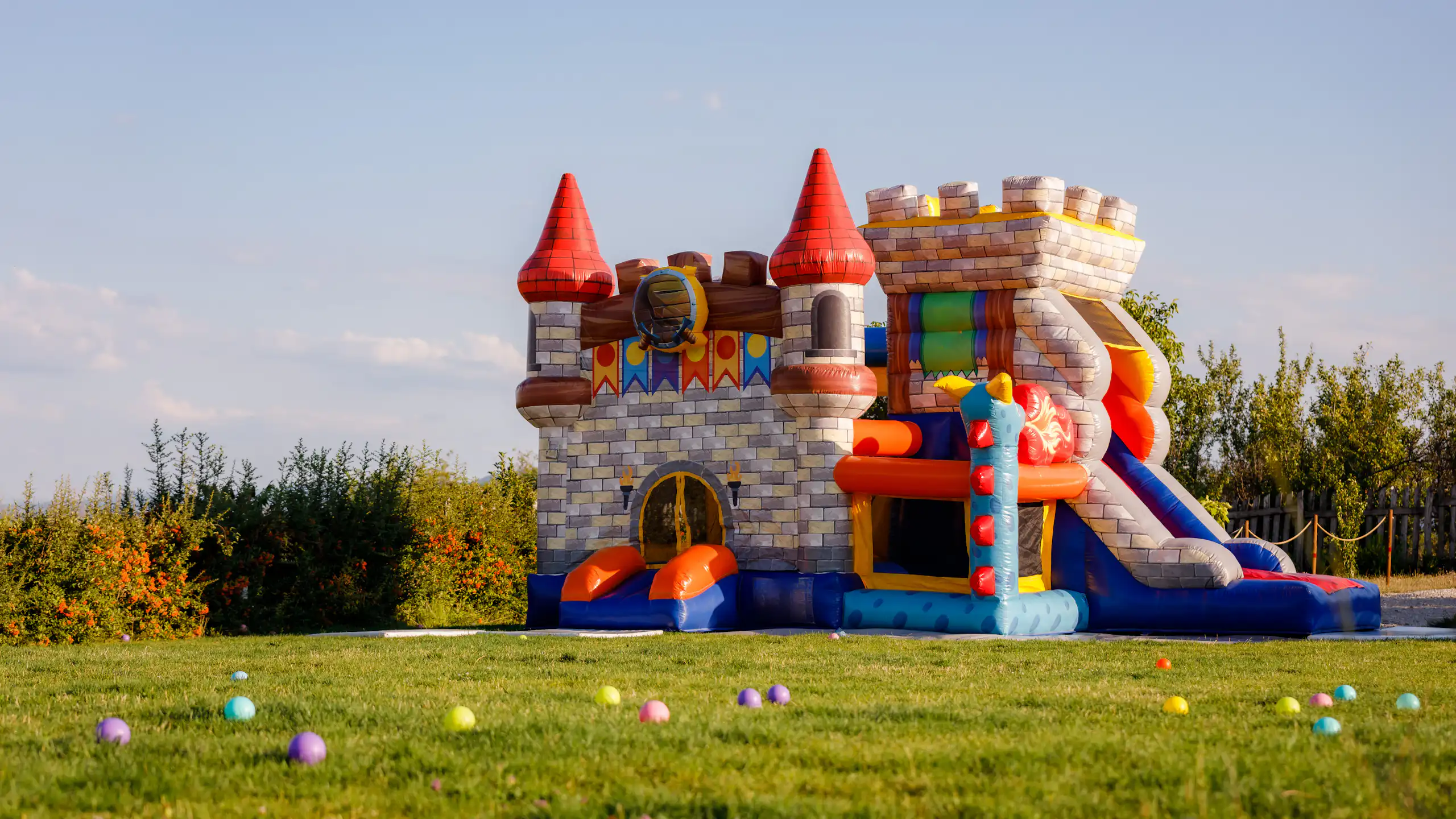 An inflatable castle on a grassy field
