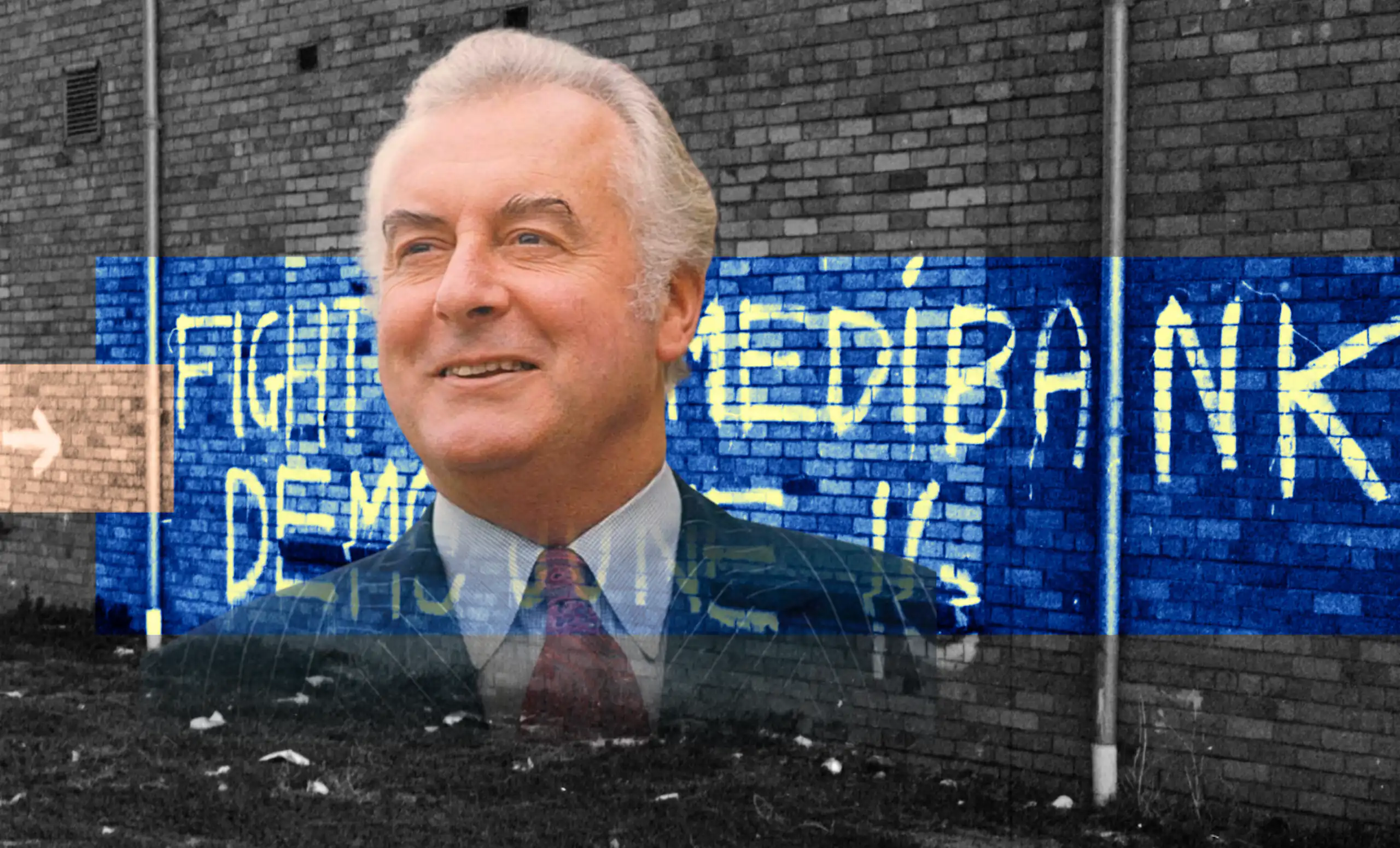 Gough Whitlam in front of graffiti supporting Medibank