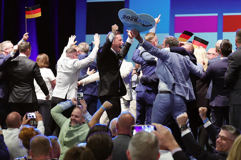 People react to exit polls during the far-right Alternative for Germany election party.