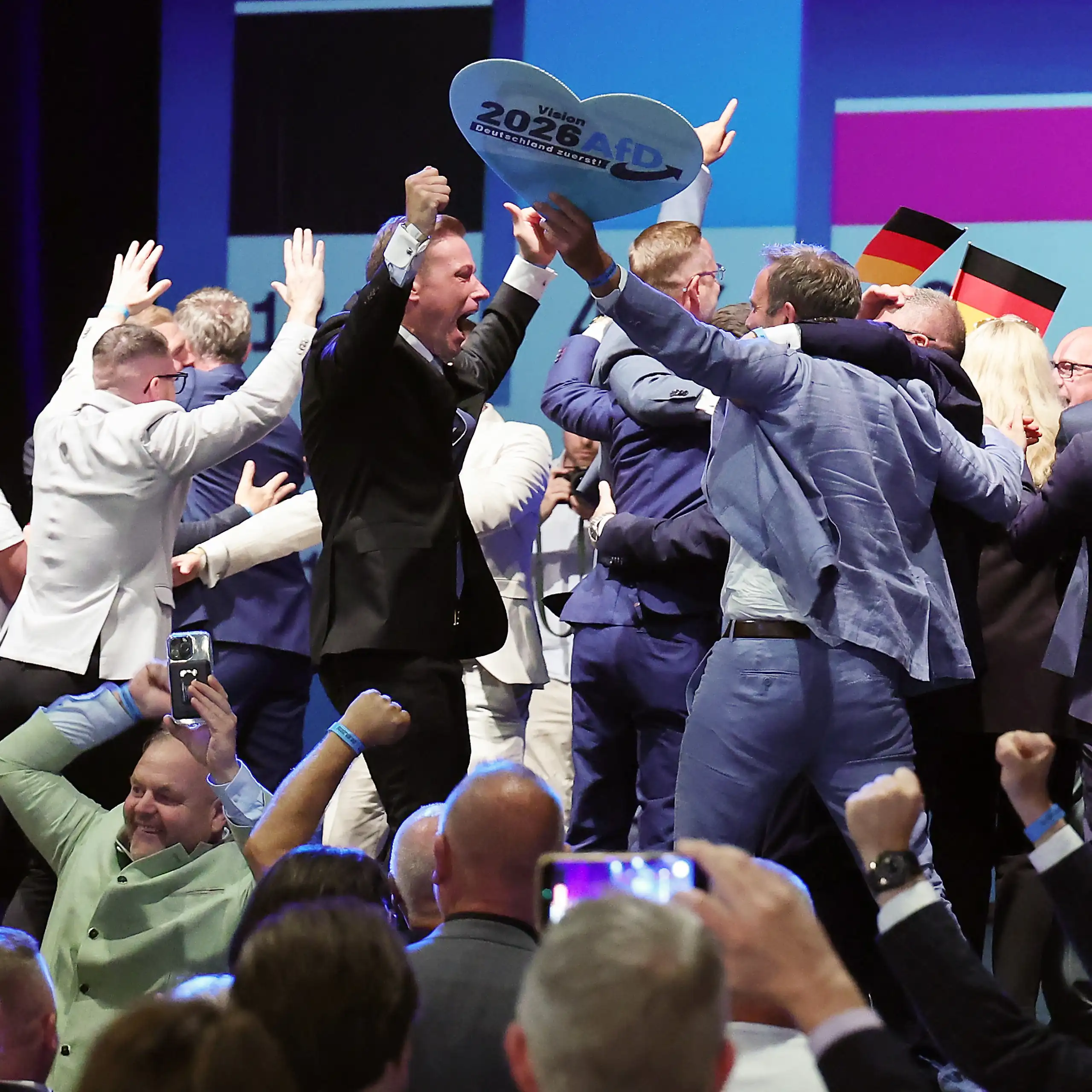 People react to exit polls during the far-right Alternative for Germany election party.