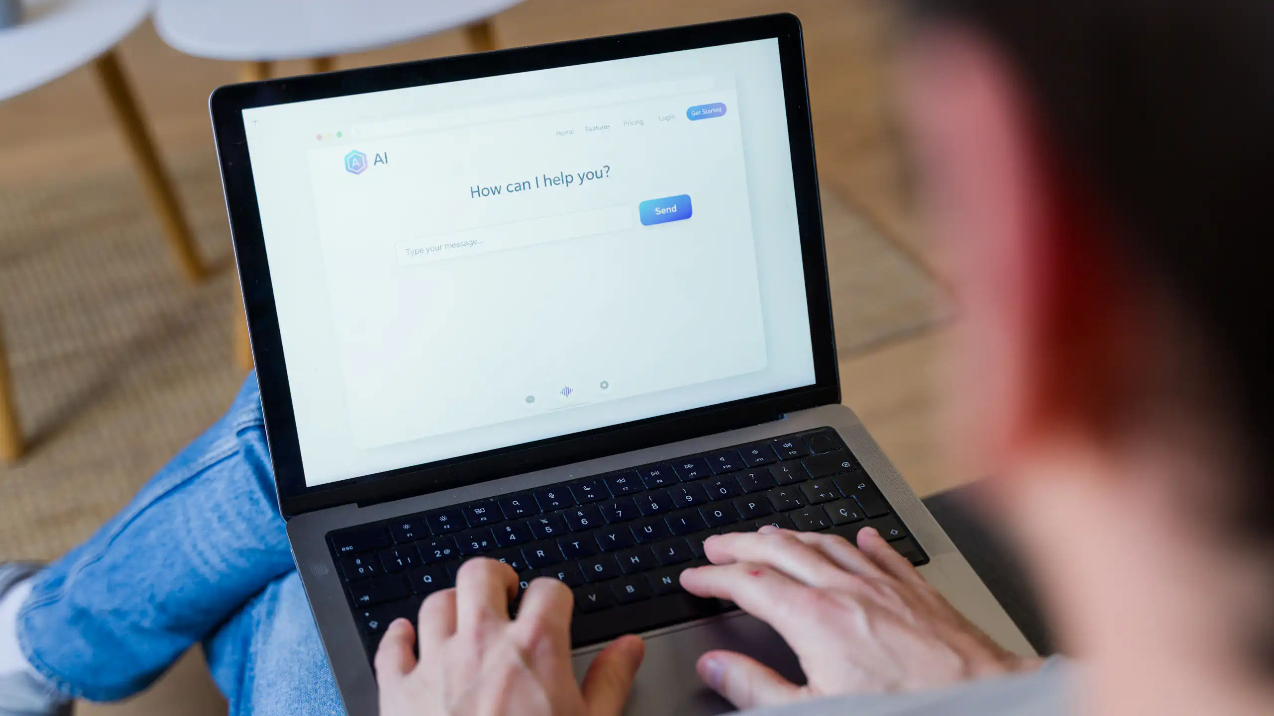 Close up of someone typing into an AI website on their laptop