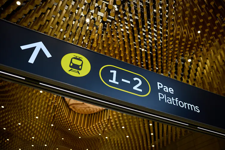 Ceiling detail from Te Wai Horotiu Station showing platform direction sign