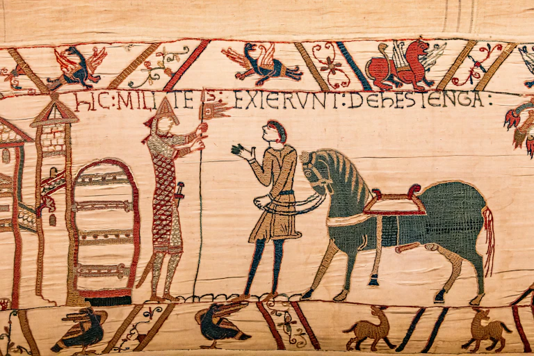 A scene from the Bayeux tapestry showing a groom presenting a battle stallion to William the Conqueror.