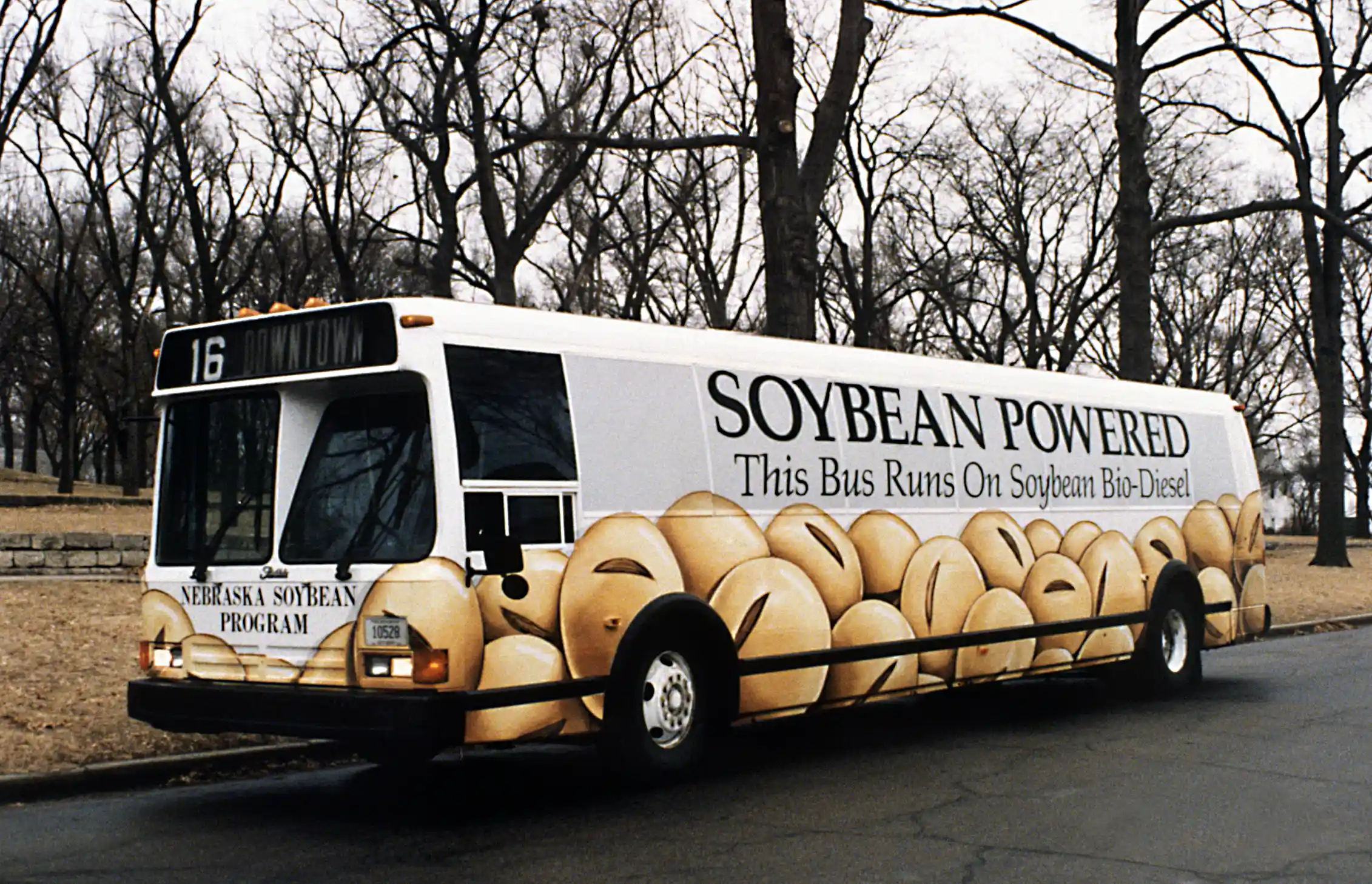 A bus carries a sign reading