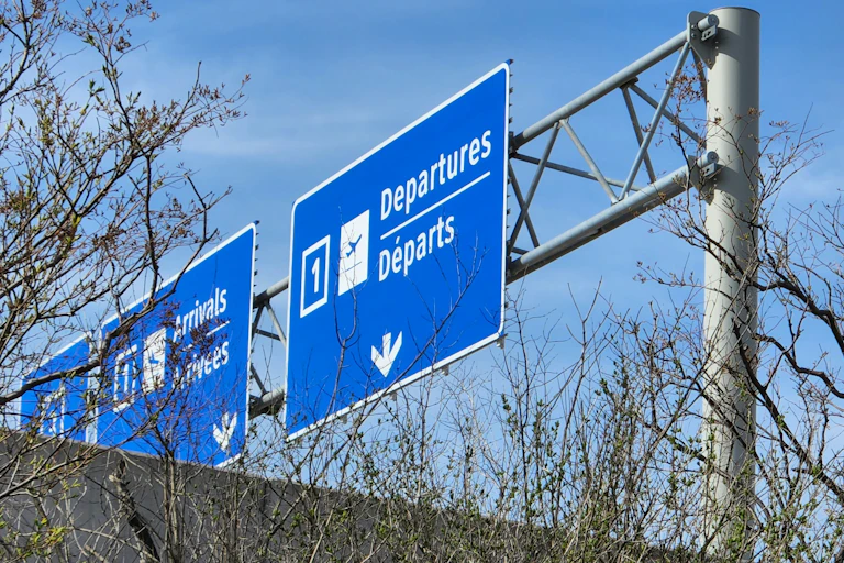 A departure sign on a road heading to Toronto's airport