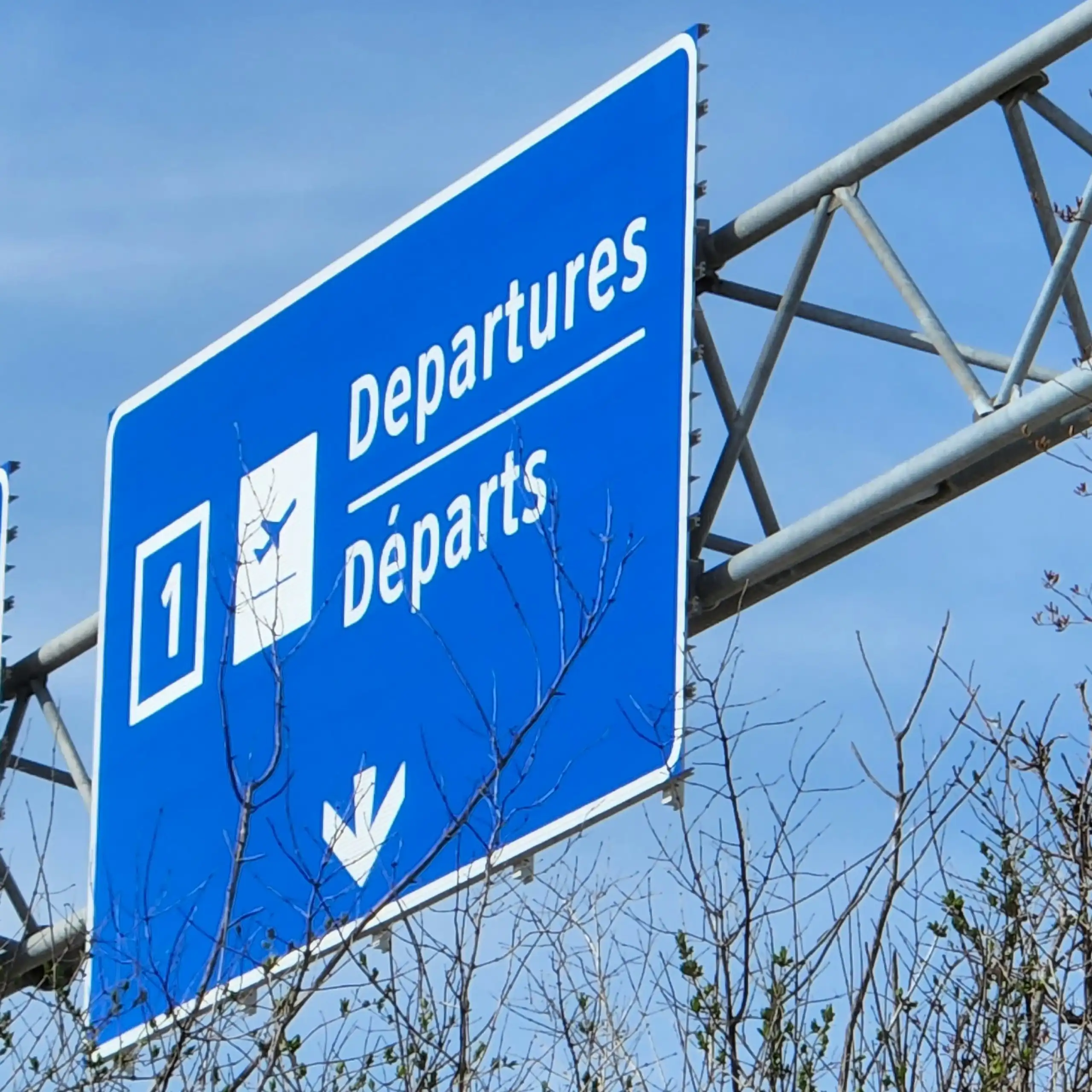 A departure sign on a road heading to Toronto's airport