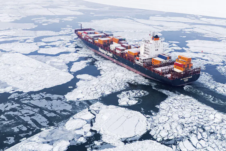cargo ship cuts through ice