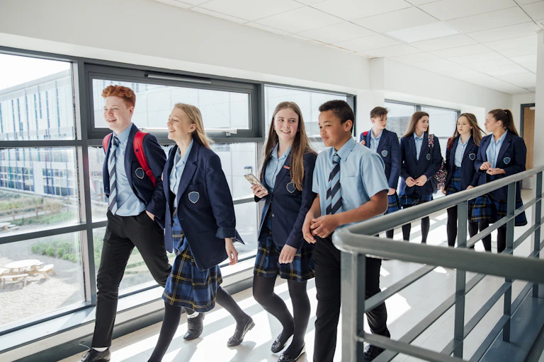 A group of high school students walking to their next class