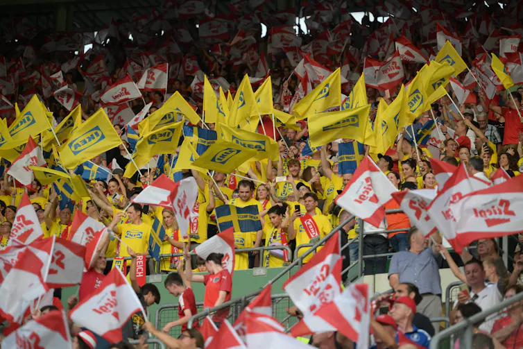 A sea of Ikea flags, with a couple of Swedish flags.
