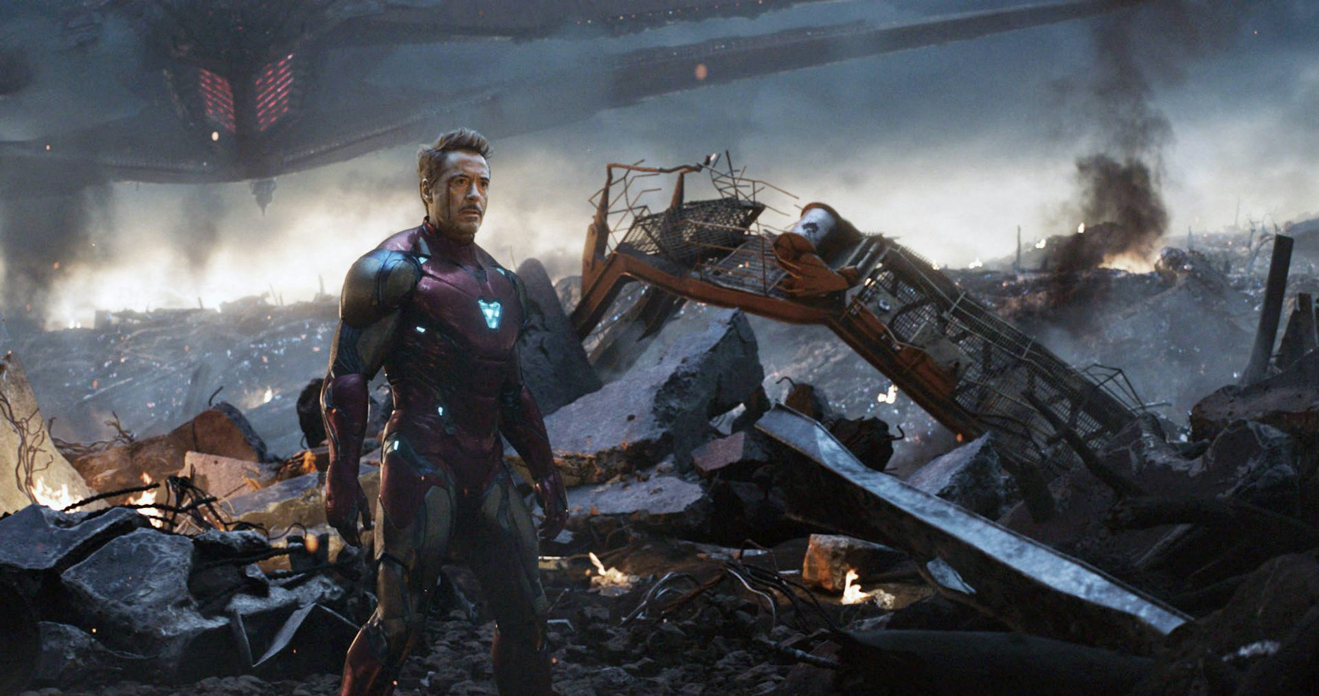 An man with a head injury standing in a desolate apocalyptic landscape beside his crashed space vehicle.