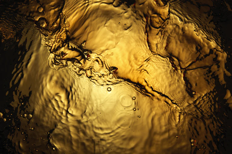 golden liquid seen from below.