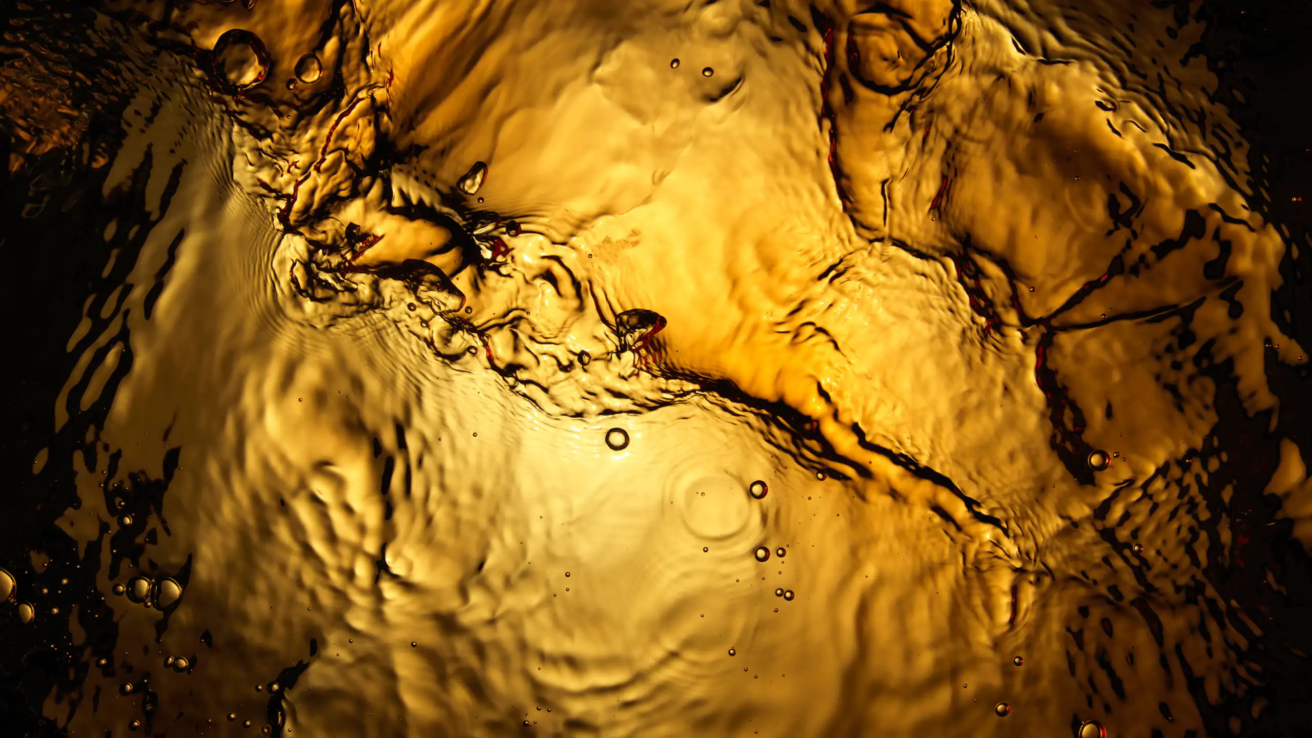 golden liquid seen from below.