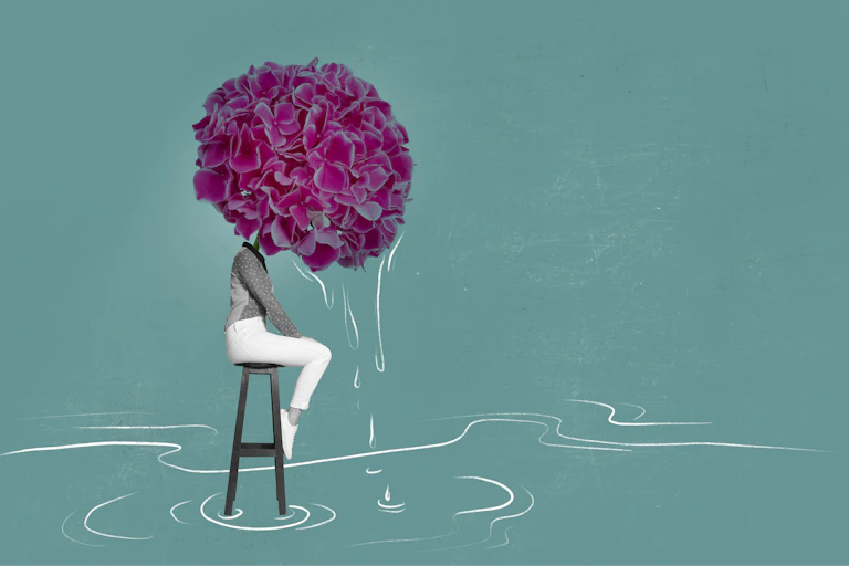 Abstract image of woman with a hydrangea for a head weeping into pool of water