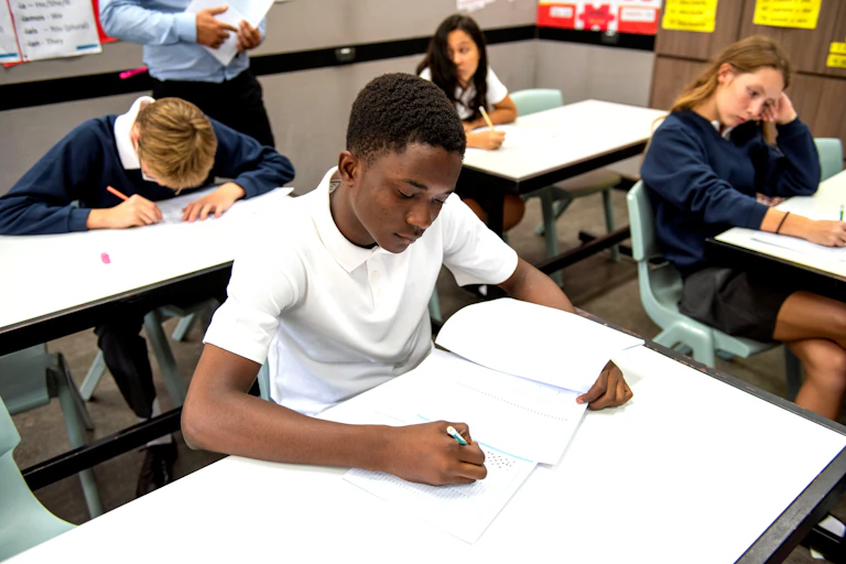 Teenagers working in classroom