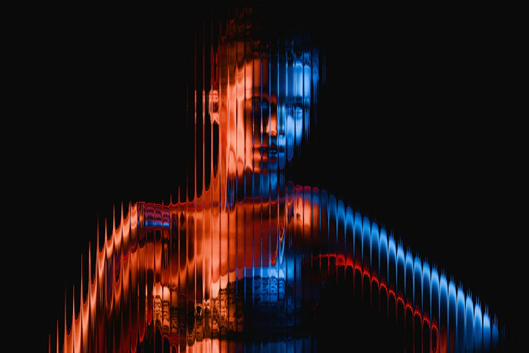 An image of a woman in a bra against a black background that has been manipulated.