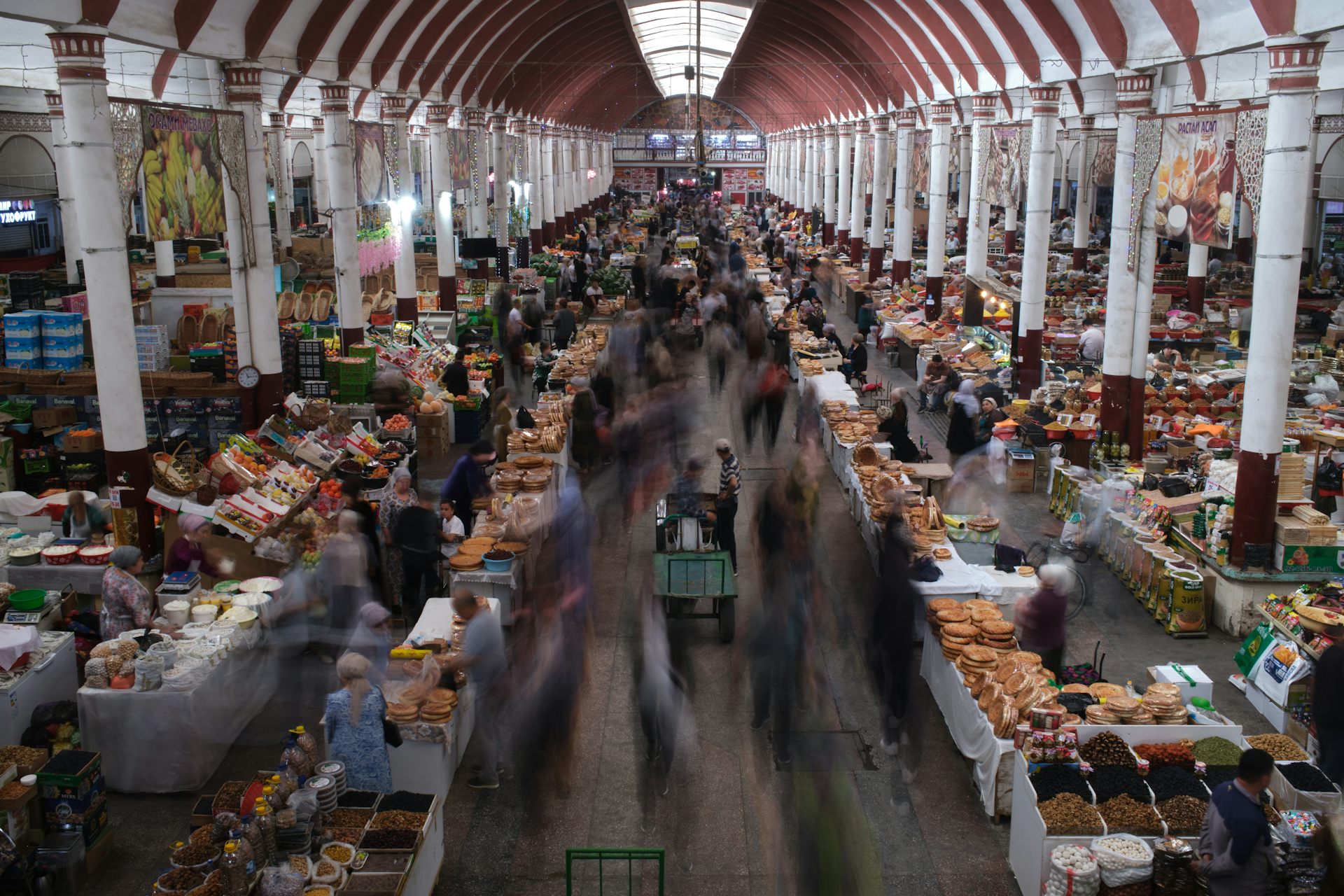 People walk through a bazaar
