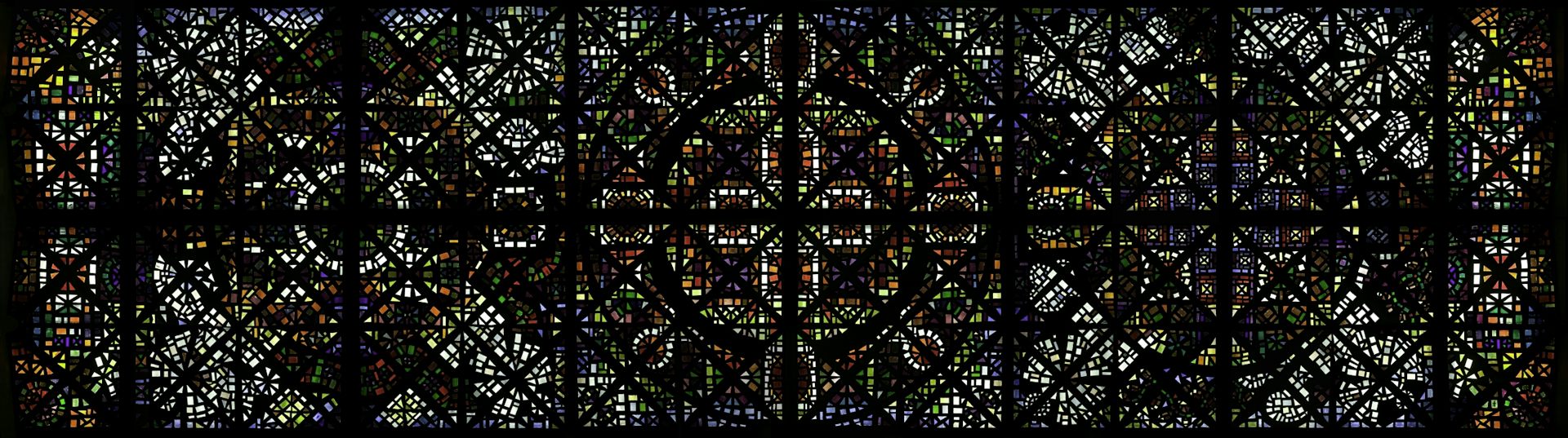 A long rectangular stained-glass ceiling, seen from directly below.