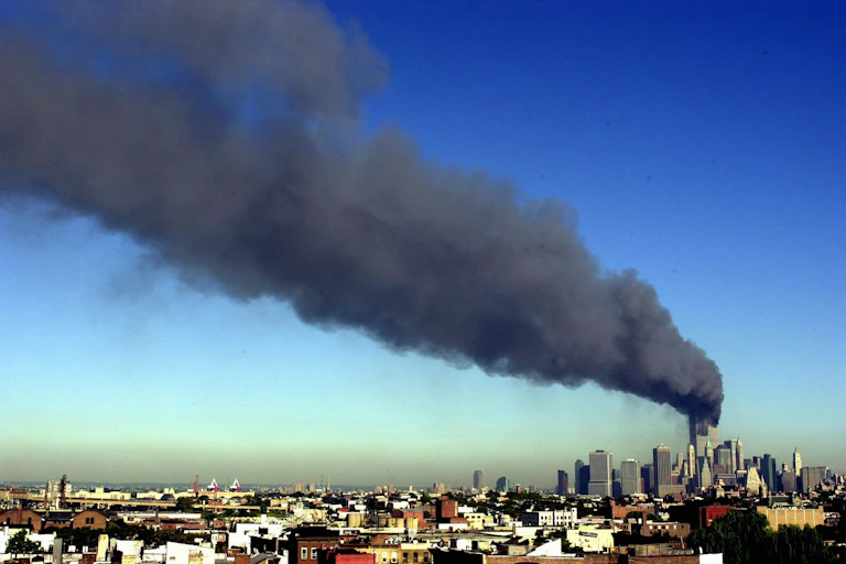 Plume of smoke from burning World Trade Centre over Manhattan skyline