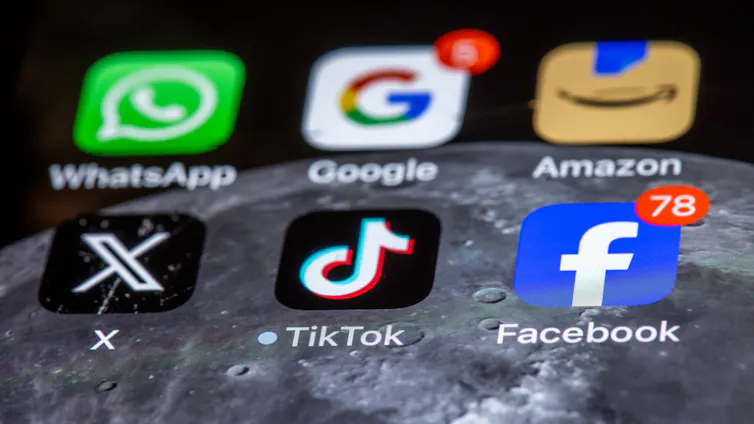 The apps of various US tech companies, WhatsApp, Google, Amazon, X and Facebook, on a phone