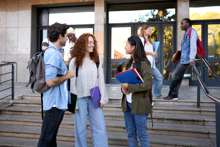A group of students hanging out after a university class.