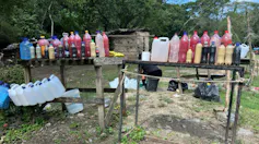 Lines of bottles containing pinkish water from the naturally pink sacred Isinuka spring.