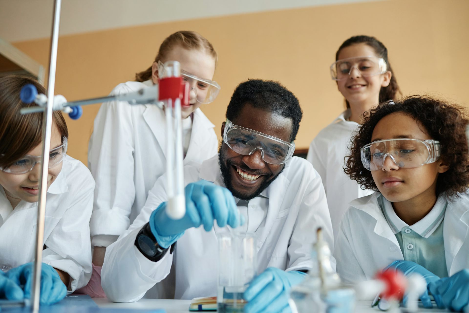 Teacher and pupils in science classroom