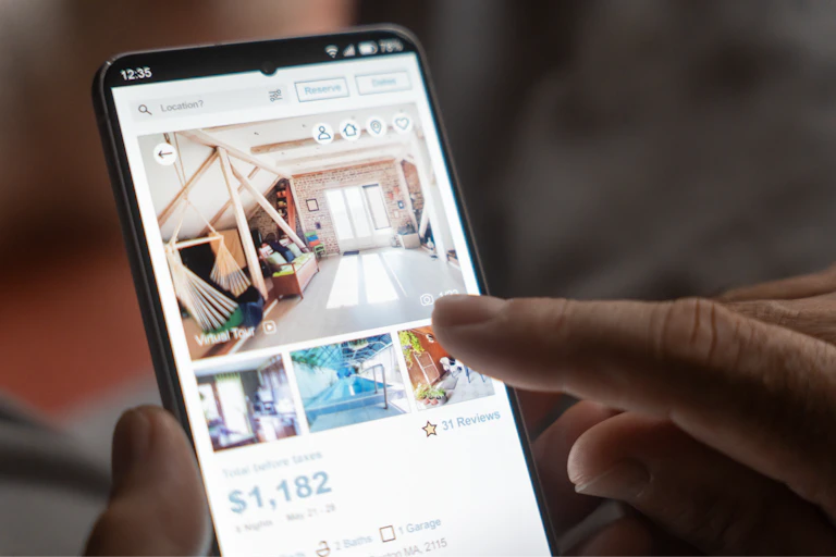Person looking at real esate app on phone
