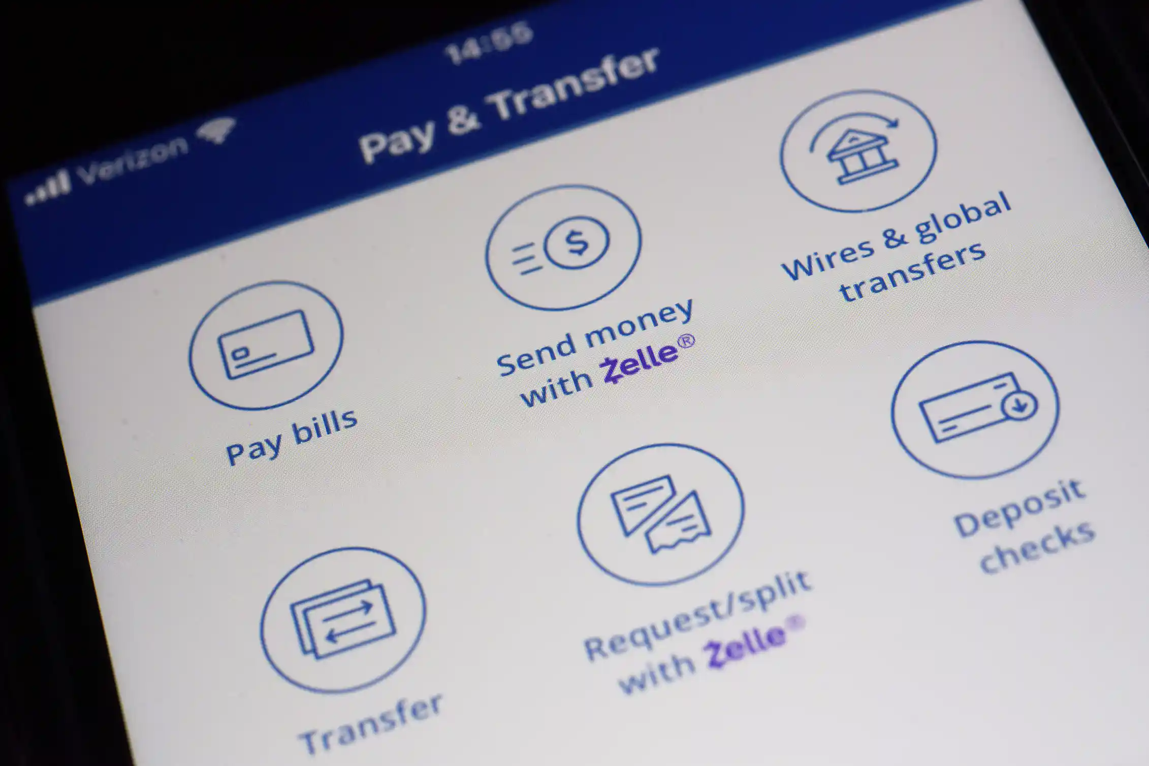 A Zelle payments app displays different options for mobile banking on a smart phone.