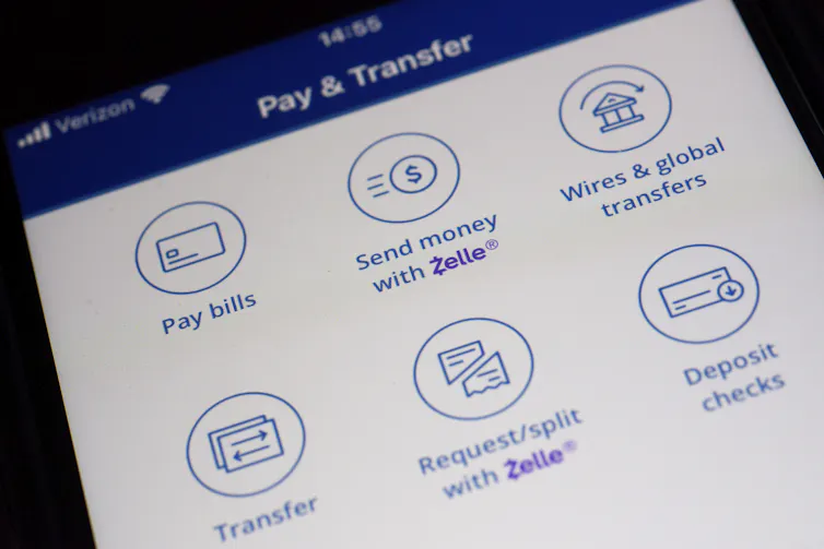 A Zelle payments app displays different options for mobile banking on a smart phone.