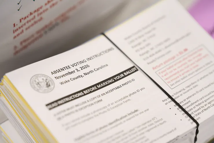 A pile of official instruction cards for mail-in ballots.