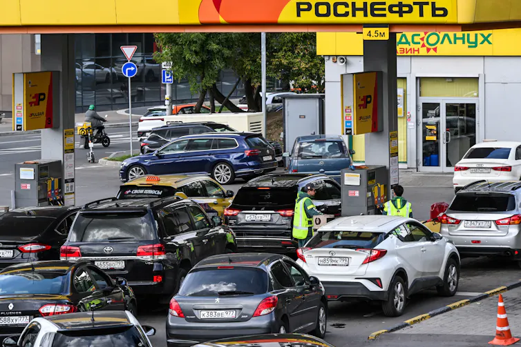 Drivers queue at a Rosneft petrol station to refuel their cars in Moscow, Russia.