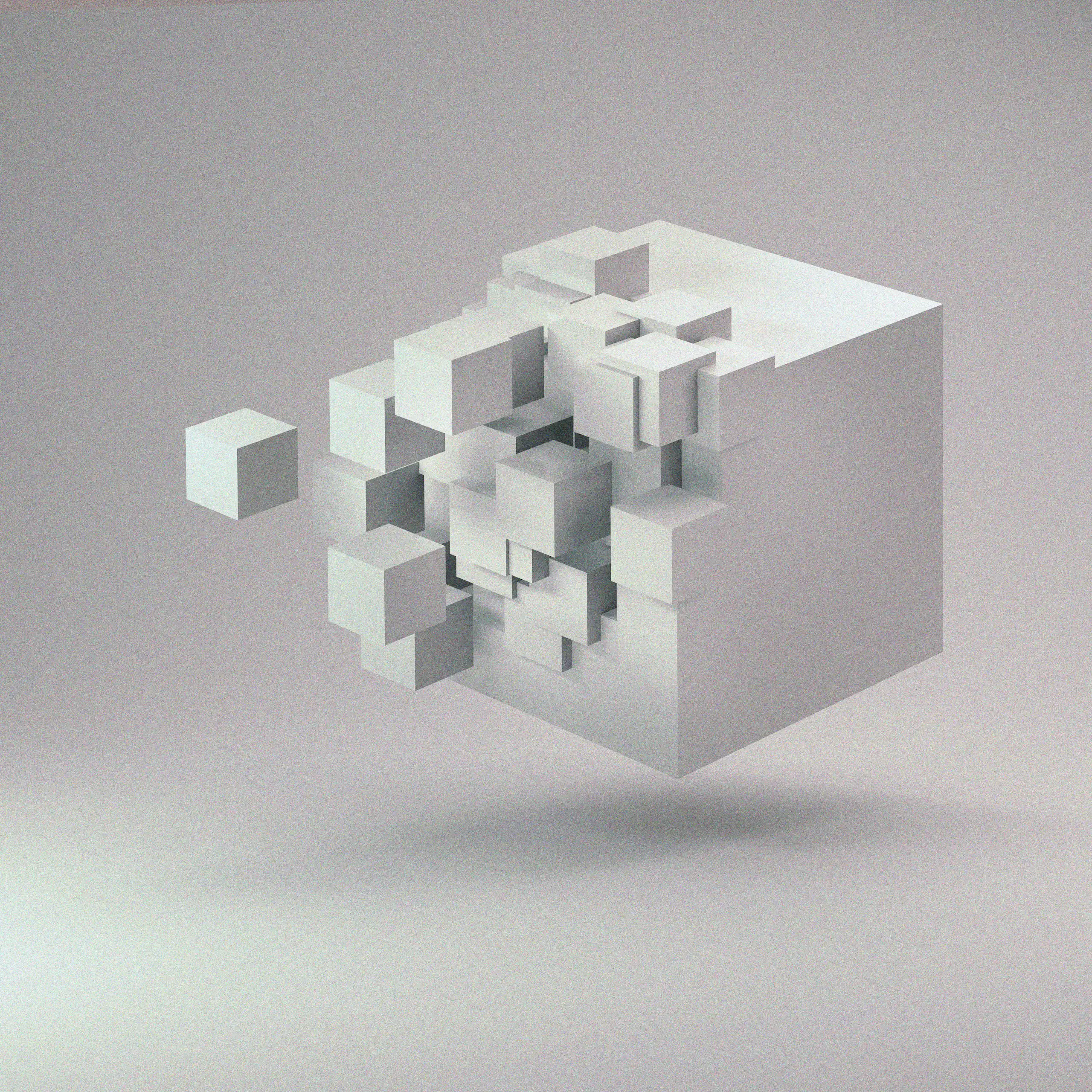 A disintegrating white cube floating in space