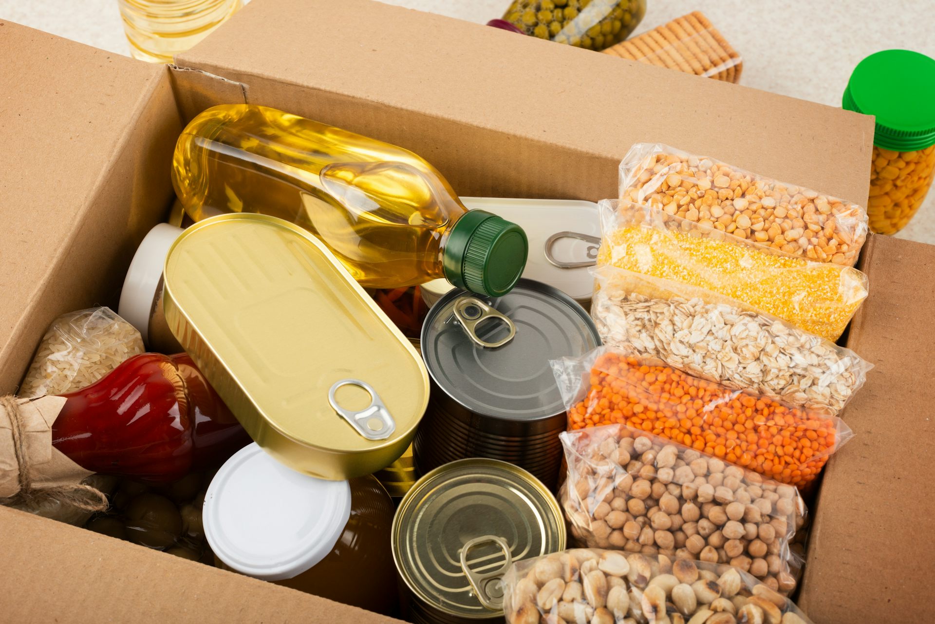 A box filled with non-perishable foods items.