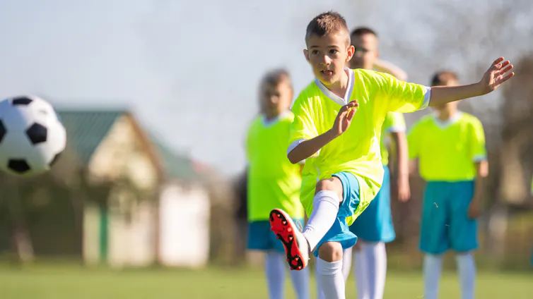 Children doing football drills