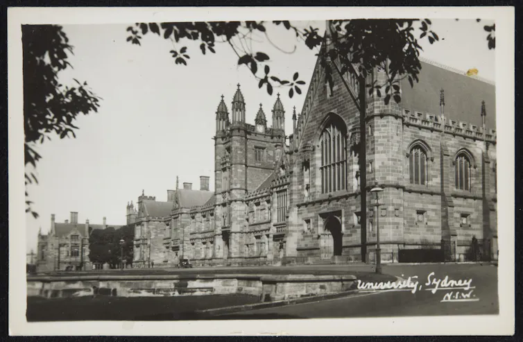 Black and white photograph of imposing buildings.